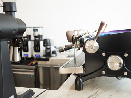 Professional like coffee making machine on table in cafe.の写真素材