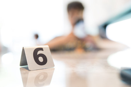 Close up tables at a restaurant, number, number sixの写真素材