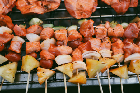 Close up of meat on barbecue grill ready for a barbeque partyの写真素材