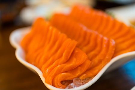 Sliced salmon sashimi, Japanese raw food delicious menu, famous fish from Norwayの写真素材
