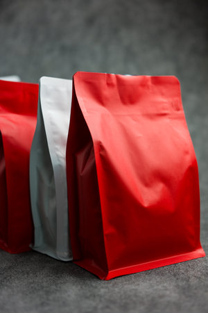 A red and white clean mockup of resealable pouch packaging. A pack of coffee beans.の写真素材
