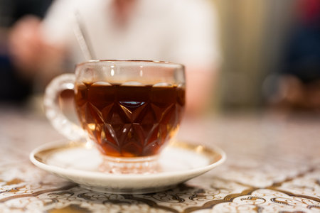 Steaming hot tea in glass mugの写真素材