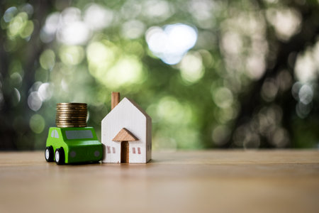 Home insurance and car. A miniature house, auto and cash. The concept of homeownership and savings. Investment and saving conceptの写真素材