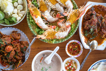 Directly above view assorted Thai seafood on wood table in Thai restaurantの写真素材