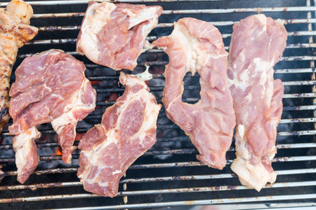 Tasty and juicy raw pork cooked on charcoal. Top viewの写真素材