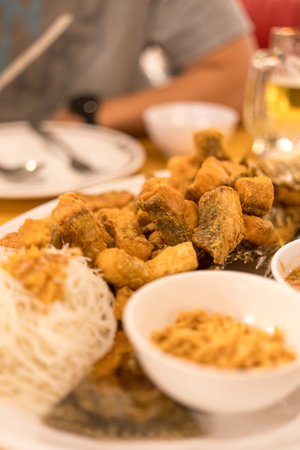 Crispy tilapia with herbal miang food, Thai food.の写真素材