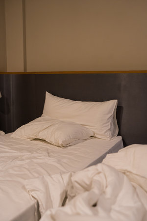 Unfinished or messy bed after wake upの写真素材