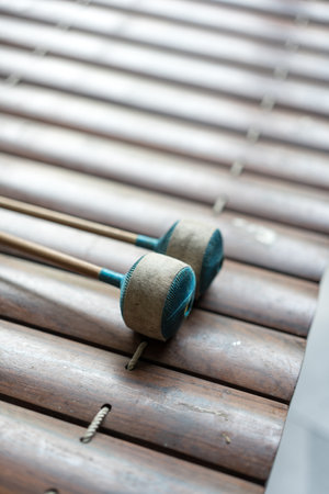 Close up of alto xylophone traditional classical Thai and southeast asia musical instrument made of wood making sound by hit sticks to wood railの写真素材