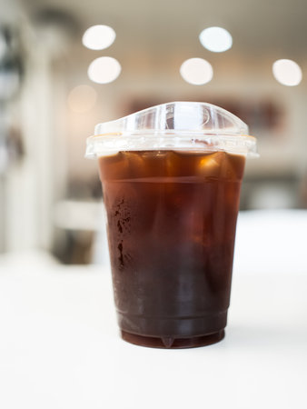 Cold brew black coffee with ice at coffee shop.