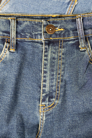 Close up of denim zipper, waist, buttons, fabric textureの写真素材