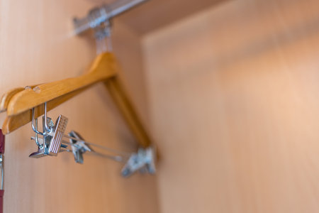 Wood clothes hanger in a wardrobe a simple wardrobe. Close upの写真素材
