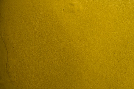 Yellow cement wall texture and background, clean and texturedの写真素材