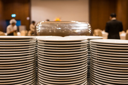 A lot of white clean plates ready to use. Restaurant utensils