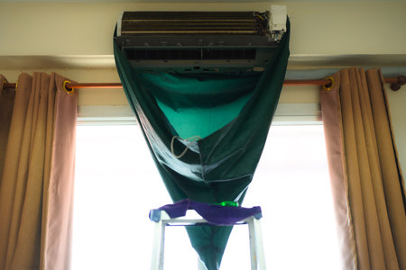 Clean the air conditioner in home. Aircondition service cleaningの写真素材