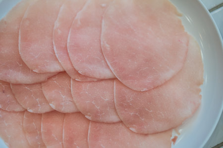 Pork slice, sliced thinly served on white dish for cooking in pot of boiling water, hot pot, hot pan