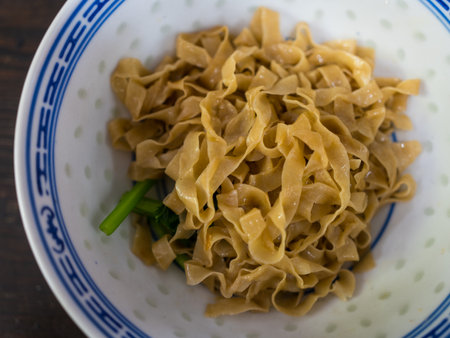 Yellow noodles menu on bowl. Top viewの写真素材