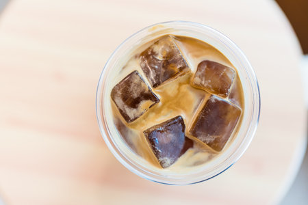 Overhead view of iced Americano in drinking glasses at cafe