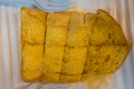 Bread toast and condensed milk with sugar. Top view