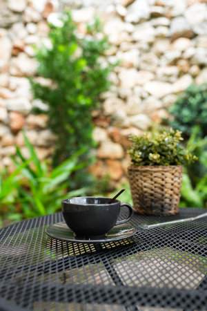 Empty black ceramic cup coffee after drink in the cafe or coffee shopの写真素材