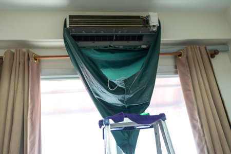 Clean the air conditioner in home. Aircondition service cleaningの写真素材