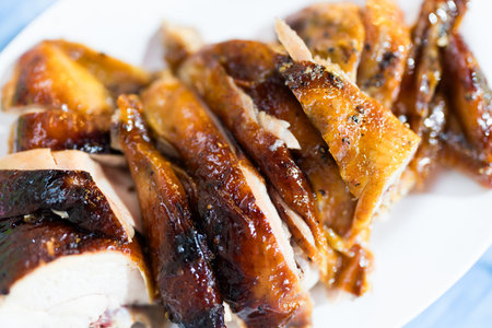Grilled chicken cut into slices served on a plate. Thai foodの写真素材