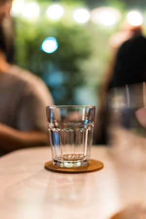 A empty glass of water on table in the restaurantの写真素材