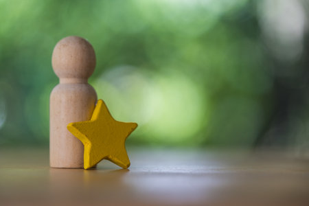 Wood figures peg doll standing together with yellow star. Talent, Human resources. Different and...