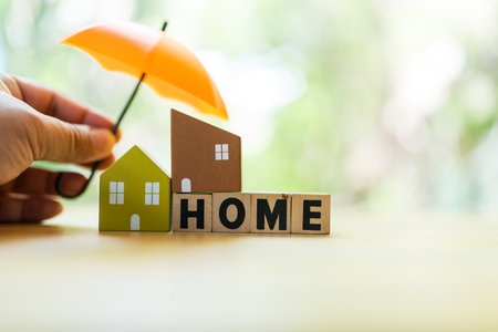 Home insurance or mortgage protection concept. Having insurance provides a sense of security and assurance, ensuring the protection and safety of both home assetsの写真素材