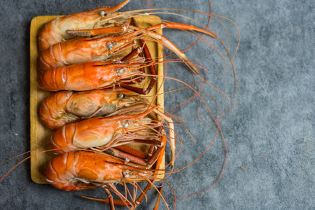 Boiled prawns, seafood big Shrimps common on wood tray placedの写真素材