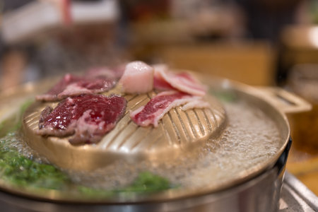 Close up of Thai barbecue buffet beef meat on the hot panの写真素材