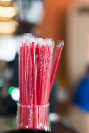 Many red colored tubules in glass jar. Close upの写真素材