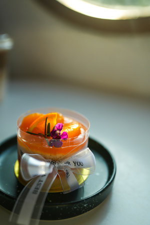 Orange jam cake topped with citrus fruits. Delicious dessert concept
