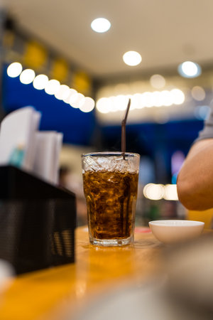 A soft drink in glass on the table. Refreshing dark sodaの写真素材
