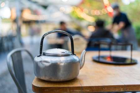 Hot broth in the vintage kettle for pour into the pan roasted pork for the Thai barbecue grill pork....