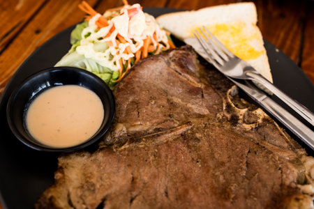 Plate of beef steak with salad and toast. Close upの写真素材