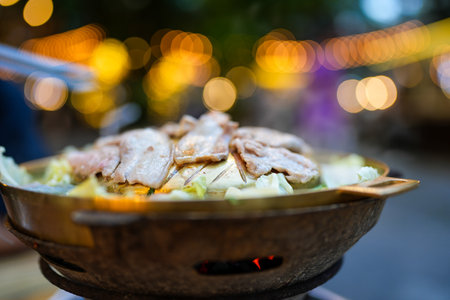 Grill barbecue on pan and hot pot street buffet thai style. Thai called Moo Kra Ta.の写真素材