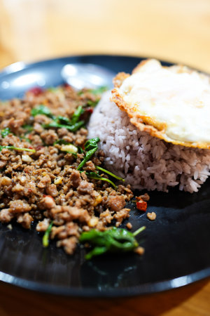 Thai stir fried basil with beef and crispy fried egg. Popular food of Thailand.の写真素材