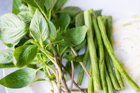 Vegetable set, sweet basil with green beans eat with Som tum. Thai authentic food