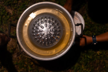 Close up of a stainless steel grill pan used in a rotisserie