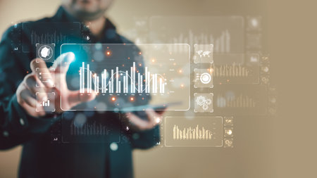 A businessman working with data management system to make report with KPI and metrics connected to database. finance, operations, sales, marketing, KPI, and business performanceの写真素材