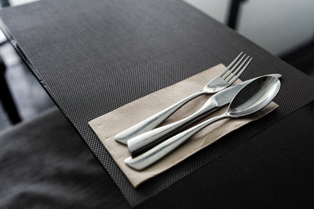 Fork, Spoon and Knife on a dining table at hotel