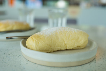 Cream filled buns with powdered sugar. Close up