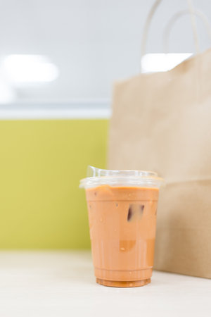 Refreshing a glass of vibrant orange Thai iced tea. Close upの写真素材