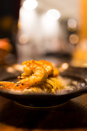 Roasted shrimp placed on spaghetti. Selective focusの写真素材