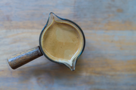 Single shot of espresso on wood tableの写真素材