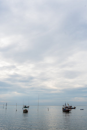 A small fishing boat anchored near Bang Saen Beach in the Gulf of Thailand. Bangsaen Beach, Chon Buri, Thailandの写真素材