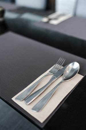 Fork, Spoon and Knife on a dining table at hotel