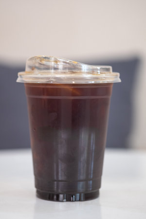 Ice Americano or iced black coffee on the table at a coffee shop.の写真素材