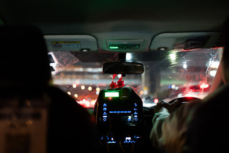 Nighttime ride in a city taxicab in Bangkok, Thailandの写真素材