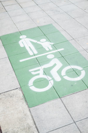 Pedestrians and bike road sign to safety